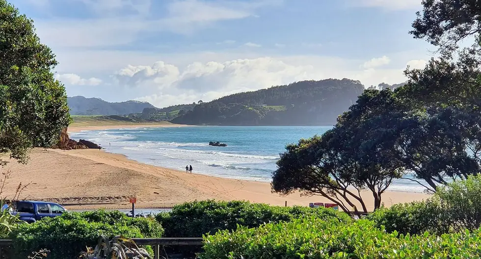 Hot Water Beach — dig at low tide and the pool fills itself