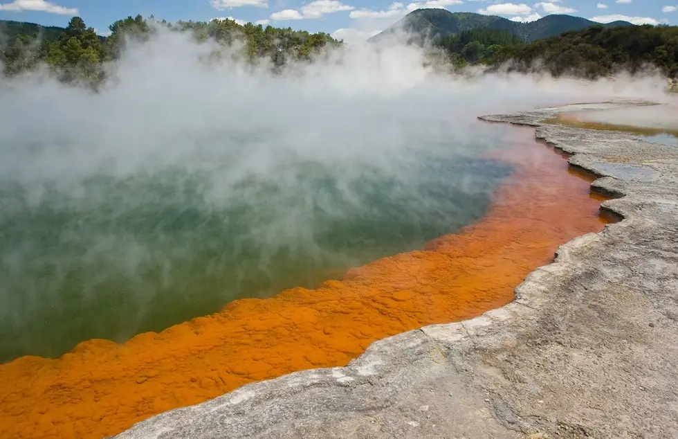 The Champagne Pool at Wai-O-Tapu — the orange rim is precipitating mineral
