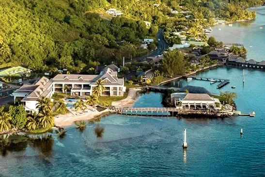 Cook's Bay Hotel & Suites from the air, showing the suites, the pool, the small beach and the restaurant out on the pier