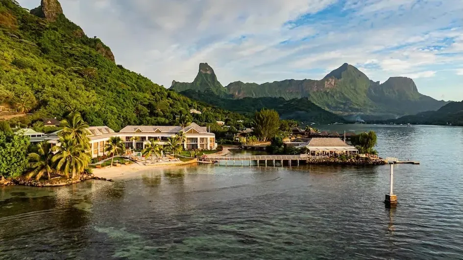 Cook's Bay Hotel & Suites on the water at Cook's Bay, with Moorea's steep green peaks rising behind it