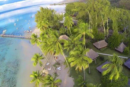 Green Lodge from the air, a small waterfront property with a jetty on the shallow lagoon