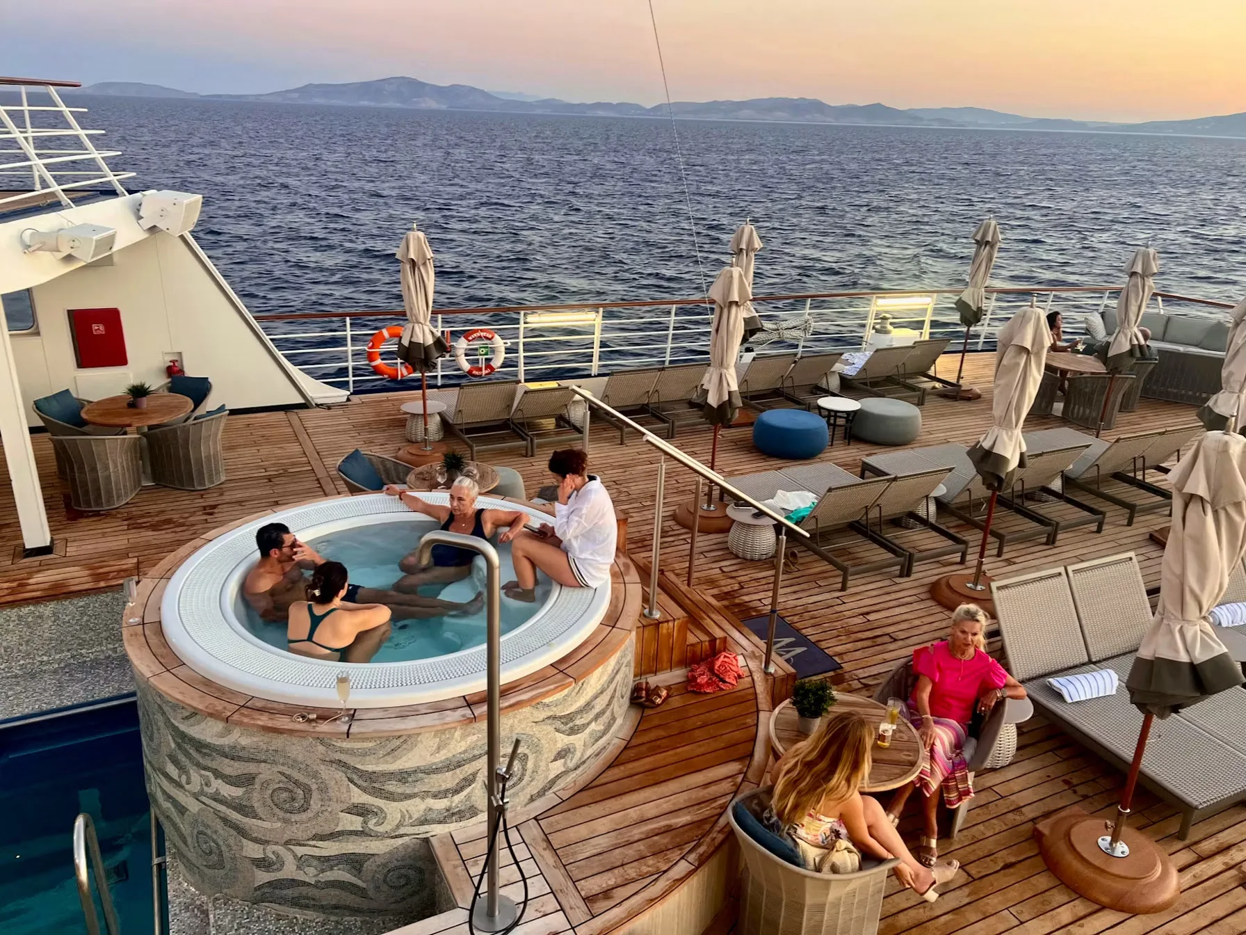 The pool deck on Wind Star at sunset